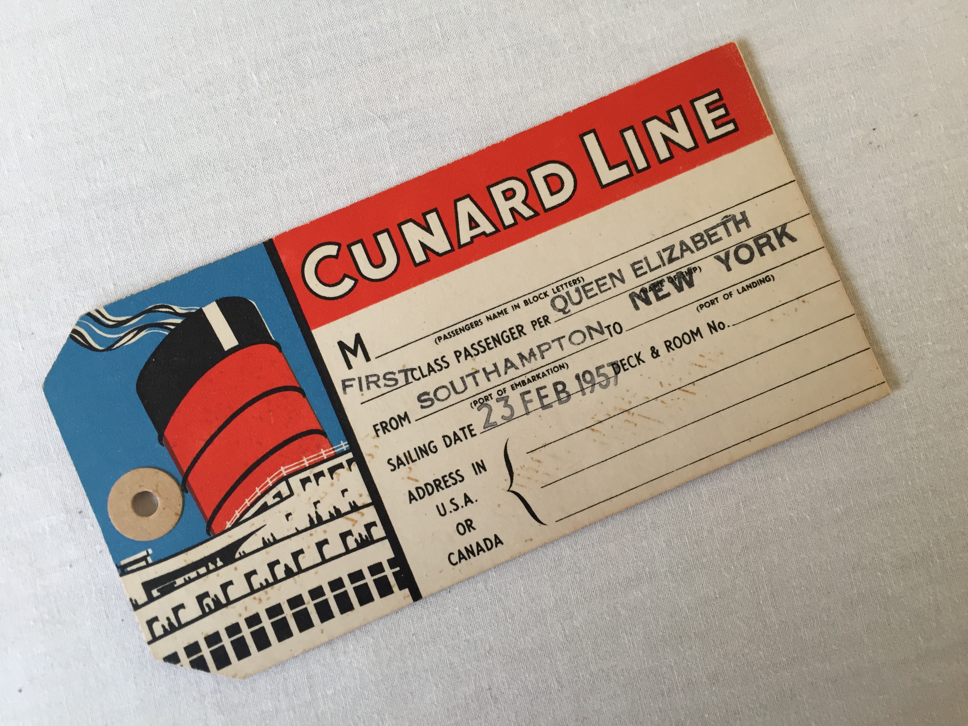 RARE FIRST-CLASS LUGGAGE LABEL FROM THE LINER QUEEN ELIZABETH DATED 1957